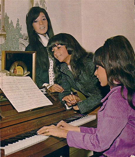 Ronettes in their Harlem NY apartment 1966_L to R Estelle Bennett_Nedra Talley_ Ronnie Bennett Spector at piano_Credit Photographer Kevin .JPG