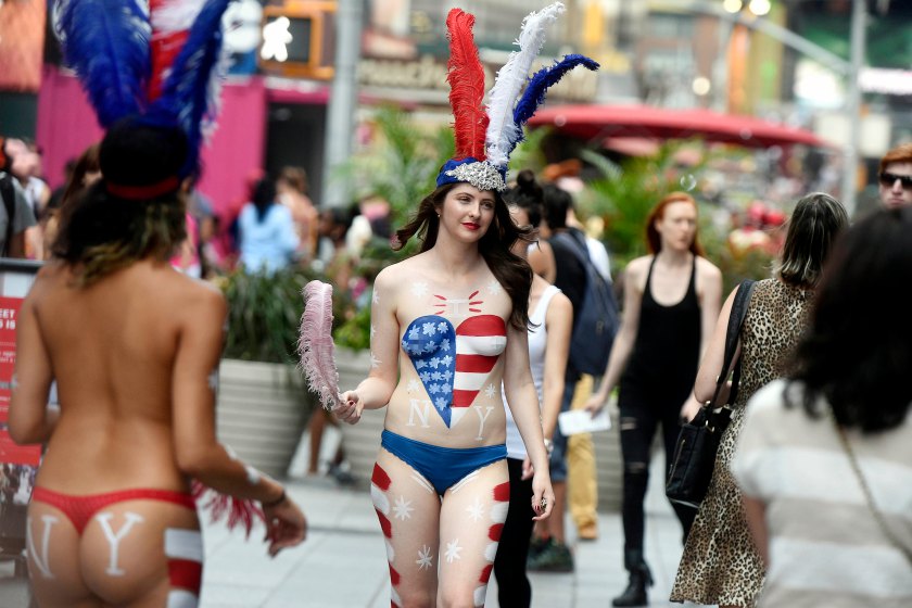 For Sunday News: 08/26/15:Topless:New York - NY Post reporter Amber Jamieson walks in Times Square as a "desnuda" as she goes undercover as a topless painted woman soliciting tips in Times Square. Photo by Helayne Seidman