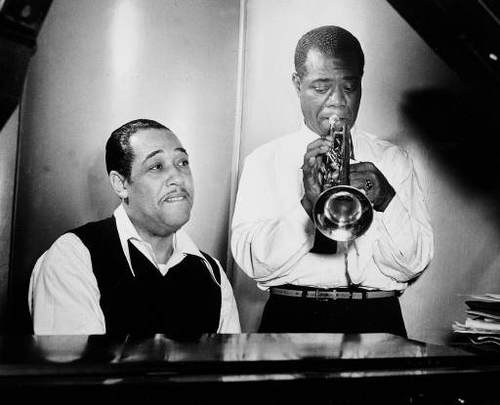 Duke Ellington at the piano and Louis Armstrong on trumpet rehearse Leonard Feather's "Long, Long Journey" during a session at the RCA Victor recording studio in New York Jan. 12, 1946. (AP Photo)