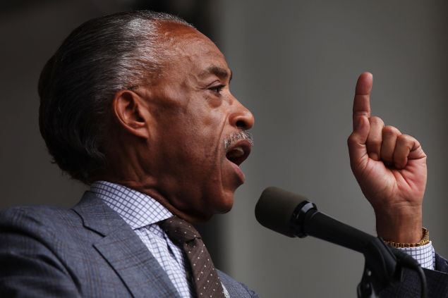 NEW YORK, NY - JULY 18: The Reverend Al Sharpton speaks at a rally in Brooklyn to call for justice for Eric Garner one year after he died in an apparent police chokehold on July 18, 2015 in New York City. The rally of several hundred people was held in front of the U.S. Attorney's Office in Downtown Brooklyn. Members of Garner's family joined Sharpton in demanding a federal investigation into his death. Garner, who was killed in a controversial choke-hold by a Staten Island police officer, had been approached by police for selling loose cigarettes. His death set off waves of protests around the city and country. Garner's family has settled with the city for 5.9 million in a wrongful death suit. (Photo by Spencer Platt/Getty Images)