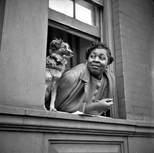 Gordon Parks - A woman and her dog in the Harlem section 1943