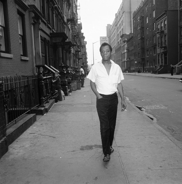 In his speech and writings, James Baldwin describes a bleak, lonely, hungry exile in which he and all American blacks, whatever their station and fortune, go from dawn to dusk in constant terror. His early exile began in Harlem's streets which he later said were filled with beautiful black people despoiled by the pressure of the white world. He is shown walking on a street in New York, June 19, 1963. (AP Photo/Dave Pickoff)